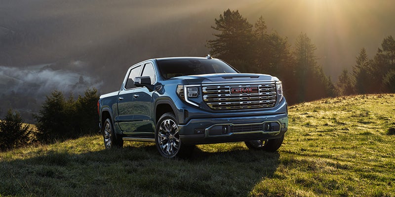All-new blue GMC Sierra 1500 parked on hill
